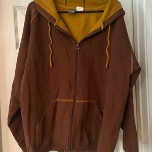 Men’s zip up hoodie by Prana.  Orange and burgundy.   Very good condition.
